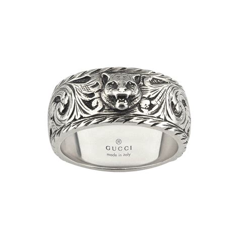 gucci feline head ring.